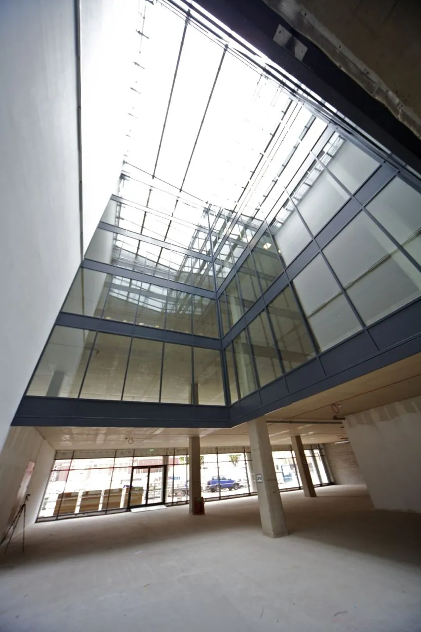 Multi-storey glazed atrium with fire resistant glass screens and rooflight