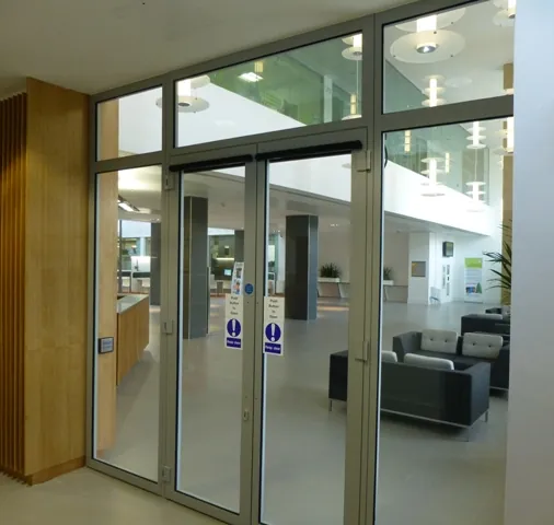 Double glazed fire doors with overpanels in an office reception